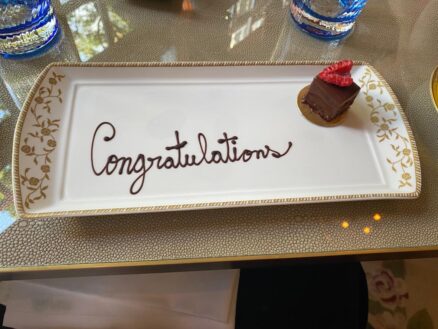 Chocolate desert with the word congratulations written in chocolate