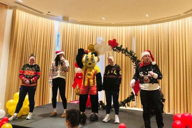 Watford FC Women's football team players Megan Chandler, Anna Filbey, Kenny Clarke and their Mascot Harry the Hornet with DJ Lee Partridge